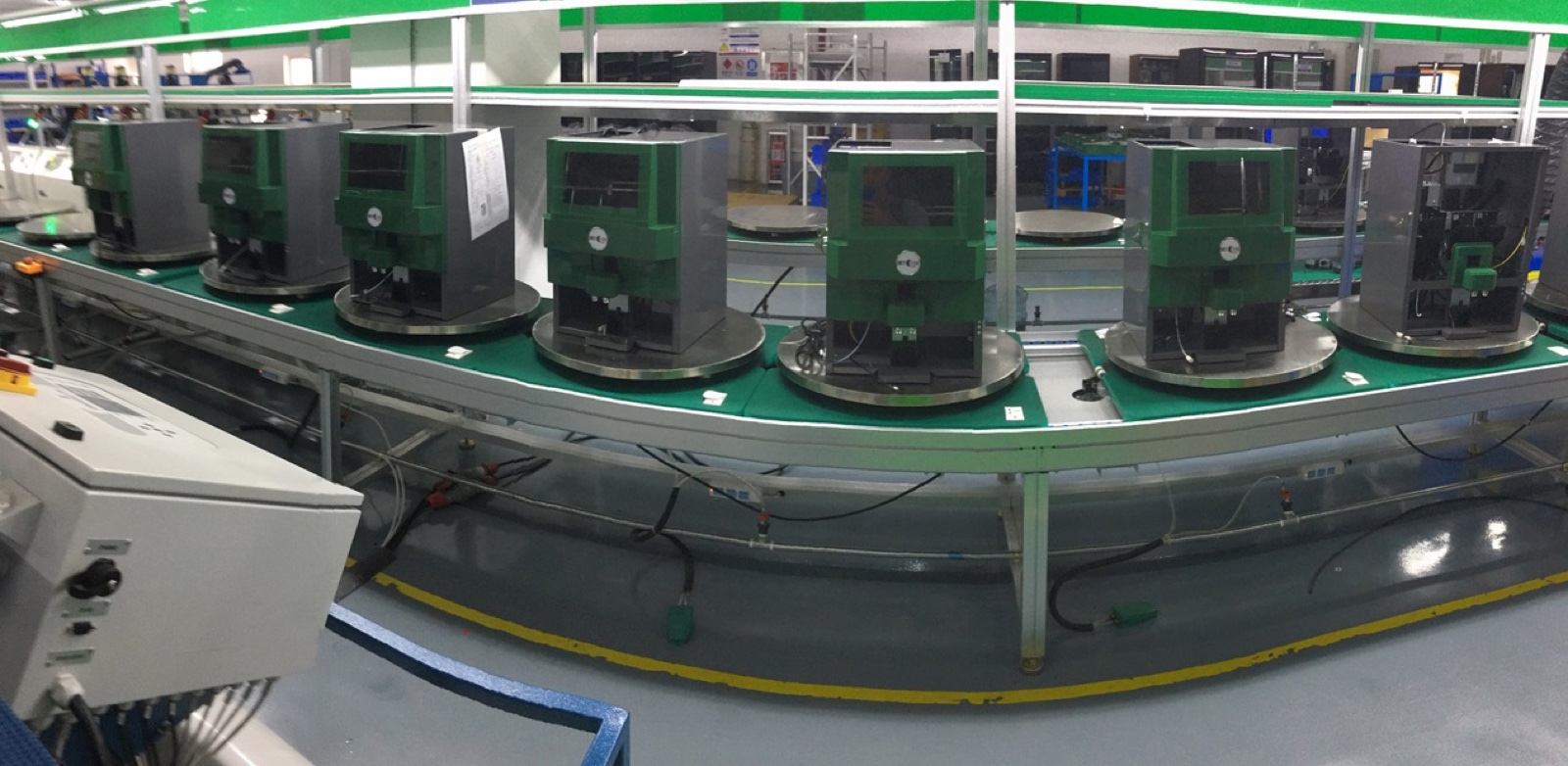 Busy Bean coffee machines moving through the production conveyor line